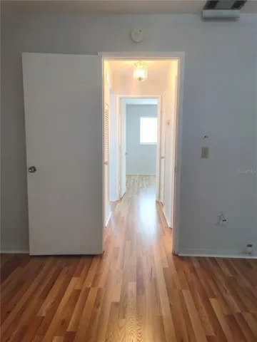 Hallway From Primary Bedroom towards Bedroom #2.  Access to Storage Closets and Main Bathroom