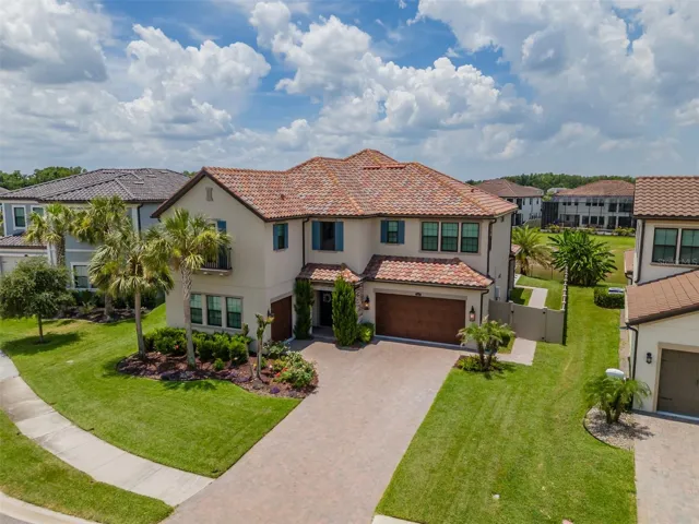 Tile Roof-Oversized Driveway and Easy Care Vinyl Fence