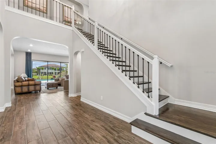Grand Entryway-showcasing the flooring and stairs