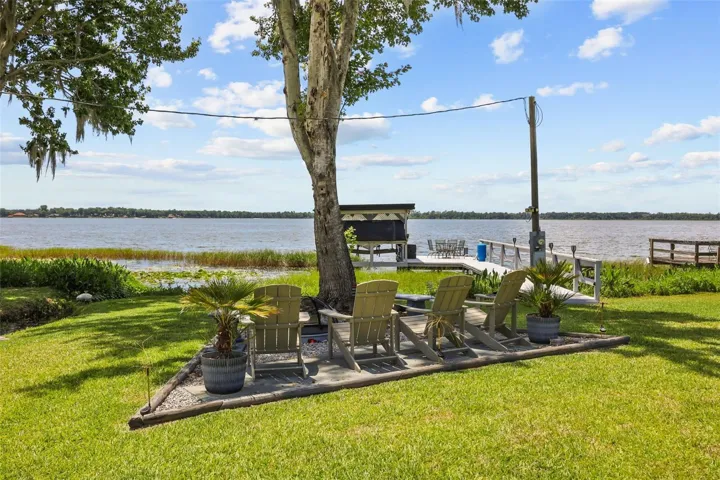 Lakeside fire pit with private dock and boat house