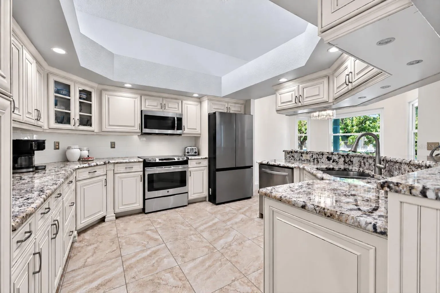 Furniture-grade cabinetry, granite countertops, stainless steel appliances, and loads of under cabinet lighting