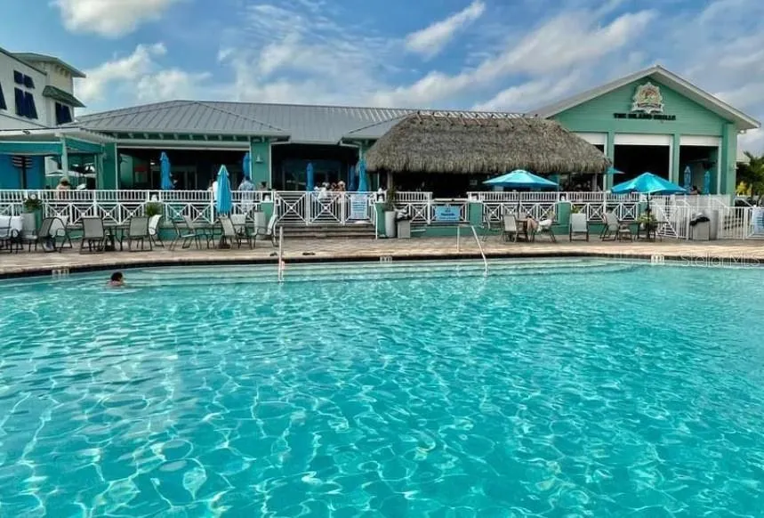 The Island Grille and Raw Bar. This serves as a community pool; for $7 you can purchase a wrist band at the Tiki Bar and enjoy food, drinks, live music and atmosphere until your hearts content!