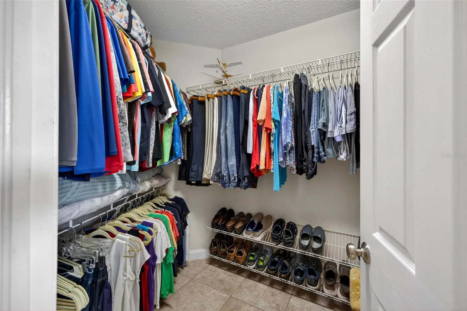 Walk-in closet is too large to fit in one photo!