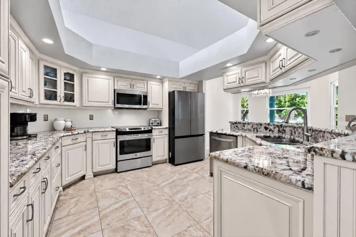 Furniture-grade cabinetry, granite countertops, stainless steel appliances, and loads of under cabinet lighting