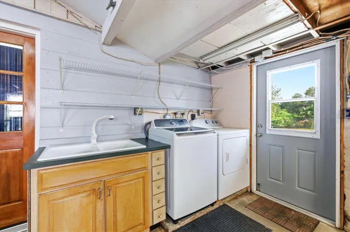 Venice Gardens Lakefront Home with Oversized Garage & Laundry Area