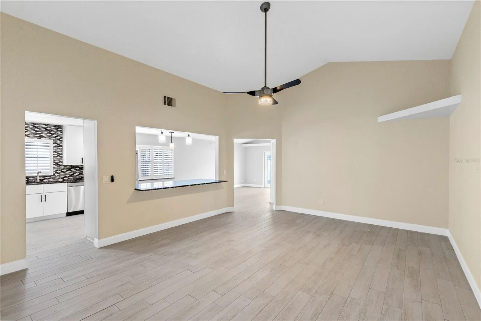 Living room off Front entry overlooking kitchen and dining area