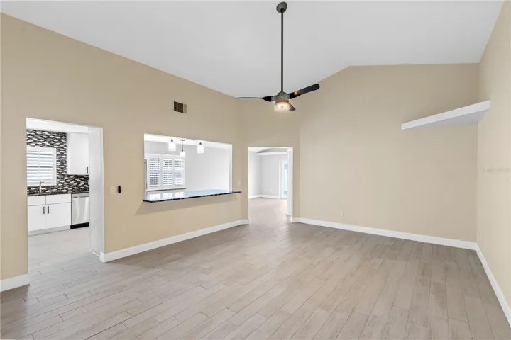 Living room off Front entry overlooking kitchen and dining area