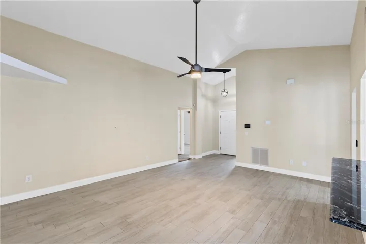 Living room off Front entry overlooking kitchen and dining area