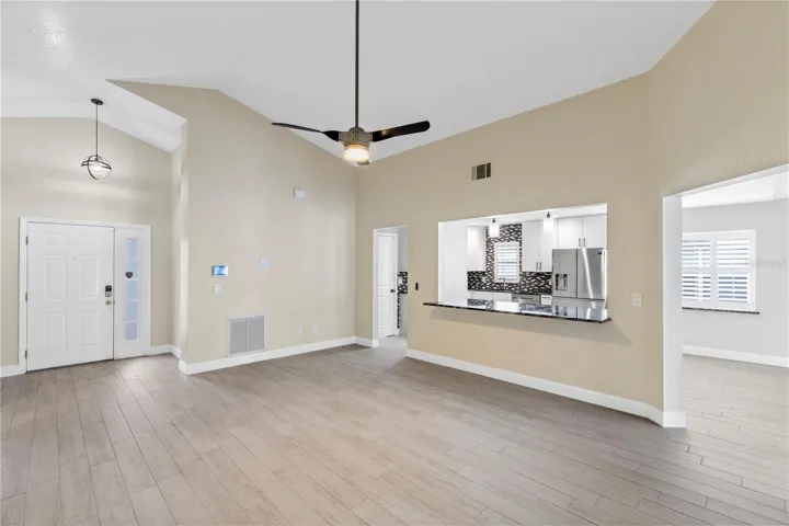 Living room off Front entry overlooking kitchen and dining area