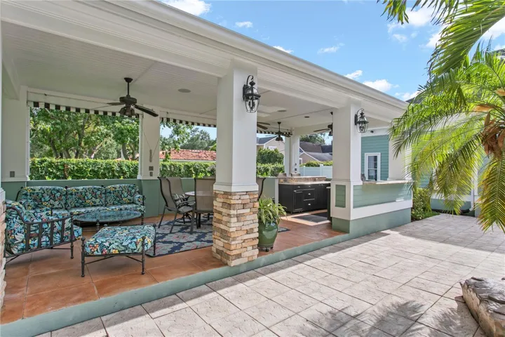 The covered cabana with ceiling fans creates the perfect space to stay cool while grilling and entertaining.