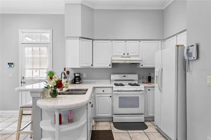 The full kitchen in the mother-in-law suite is perfect for holiday gatherings, offering extra ovens, generous counter space, and comfortable guest accommodations.