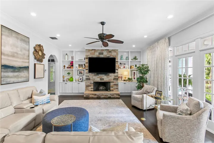 Bright and inviting, the family room features generous seating space, a gas fireplace, and plenty of natural light.