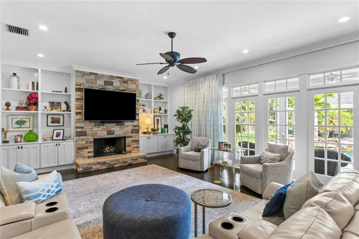 Bright and inviting, the family room features generous seating space, a gas fireplace, and plenty of natural light.
