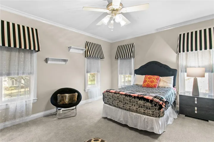 The second bedroom upstairs features a walk in closet and en-suite bathroom