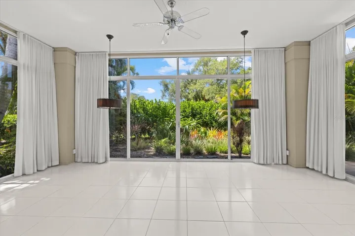 Florida Room with High Ceiling & Floor to ceiling sliders