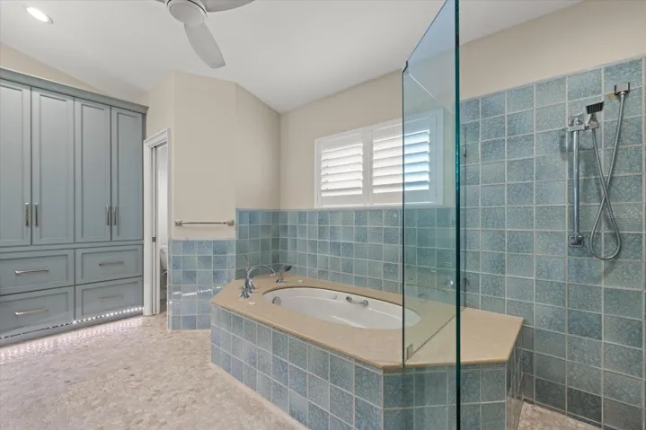 Renovated Primary Bath: Glass tiled Shower & Soaking Tub