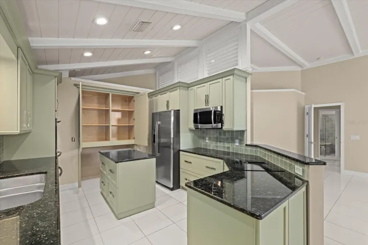 Chefs Kitchen with huge pantry with floating island