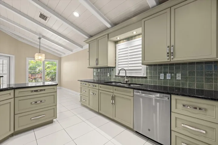 Kitchen with lots of Painted wood cabinetry