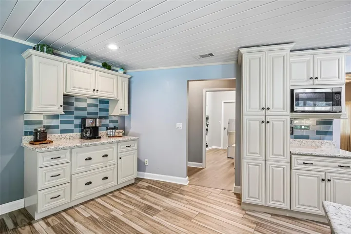 Coffee bar off the dinette area and view of the panty and additional cabinets
