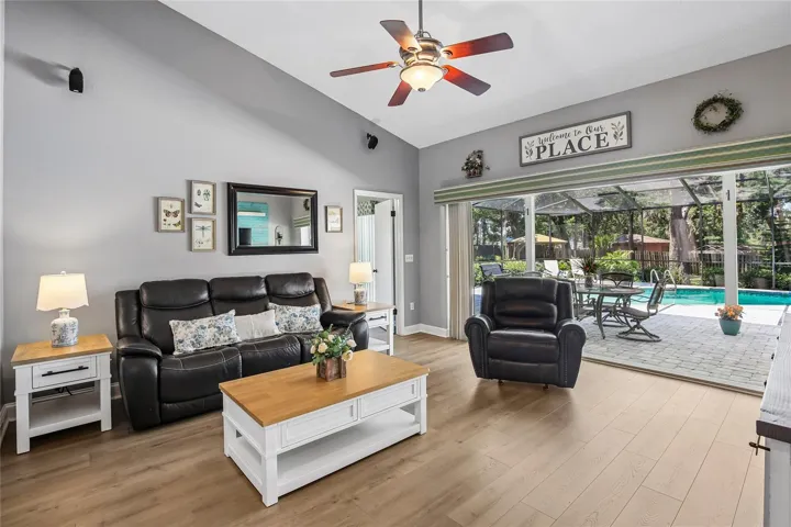 Living Room with pocket sliders that open the back of the home to the lanai