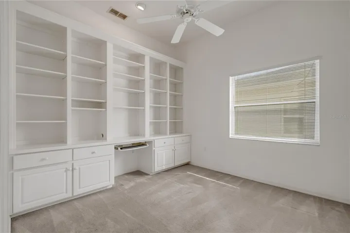 Bedroom 2 - used as an office with wall of built-ins.