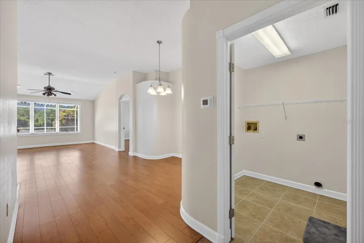 Foyer looking into laundry room and dining room