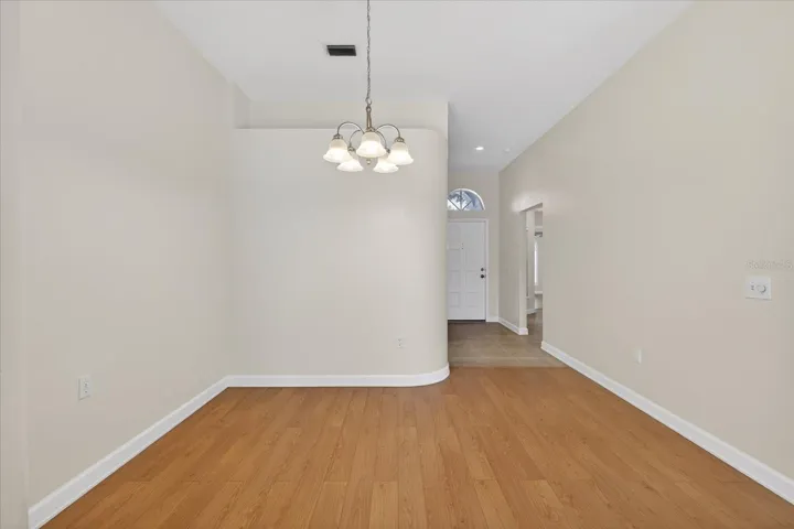 Dining room view facing foyer to front door
