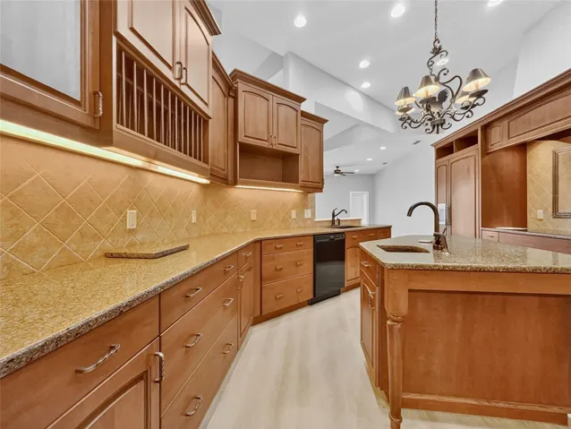 Granite counters and warm wood cabinets create an inviting kitchen