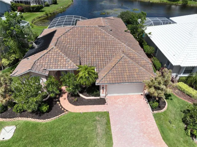 Paver driveway and sidewalk, tile roof, lake view. Yes!