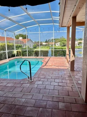 Pool and lake view. Hurricane fabric protection.