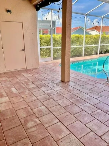 Lanai with storage closet for pool supplies and toys