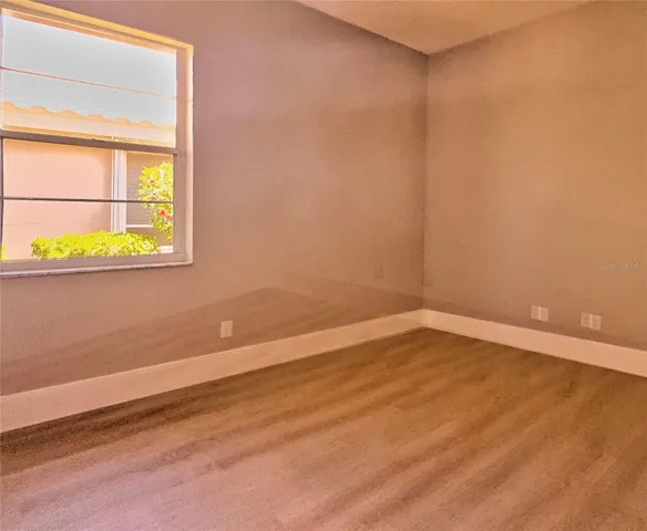 Guest bedroom 2 with new lux vinyl plank flooring, fresh paint.