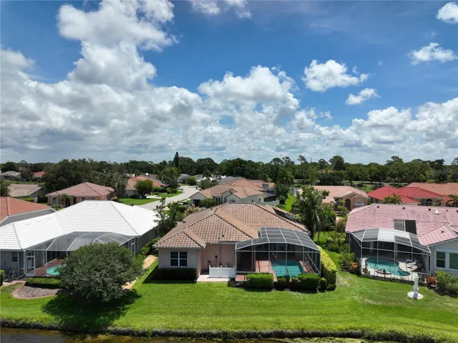 Mature landscaping, lake view from living room, family room, primary and 4th bedrooms