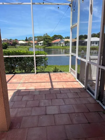 Paver lanai with 2 covered sitting areas, room for your grill