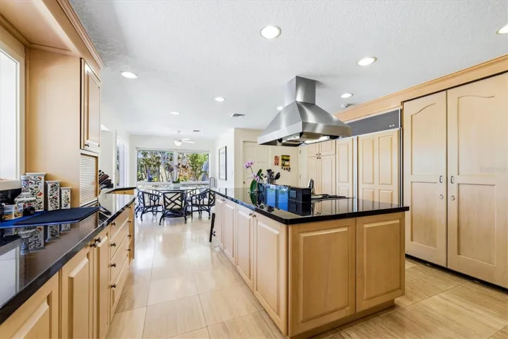 Kitchen has a spacious island and wine closet