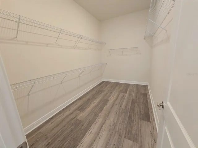 large walk-in closet primary bedroom