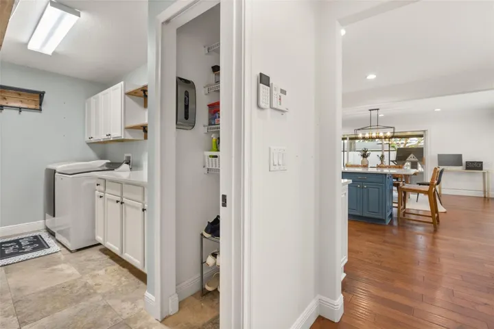 Generous Laundry room with storage
