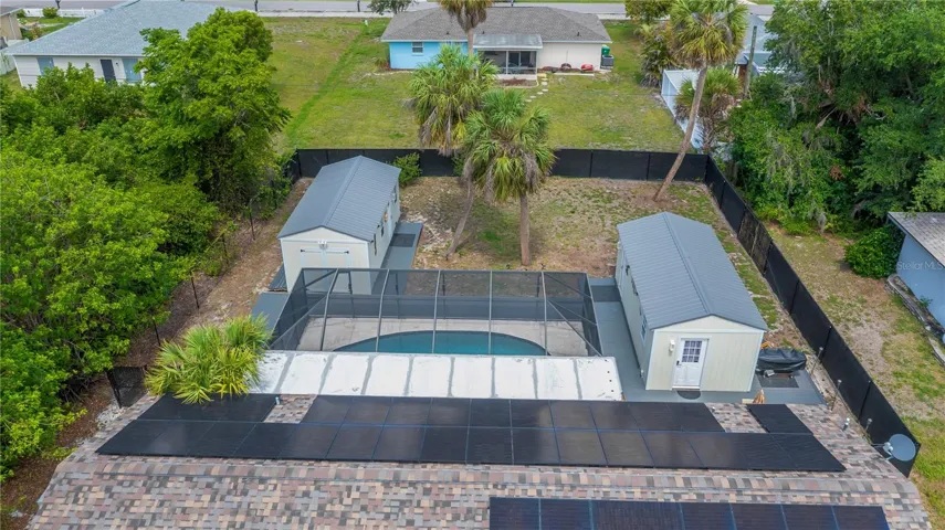 FULLY PAID SOLAR, Heated Saltwater Pool & Two Detached Living Spaces!