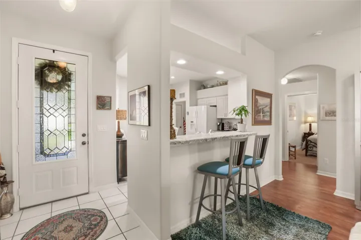 Open floor plan provides seamless flow between the living, dining, and kitchen areas.