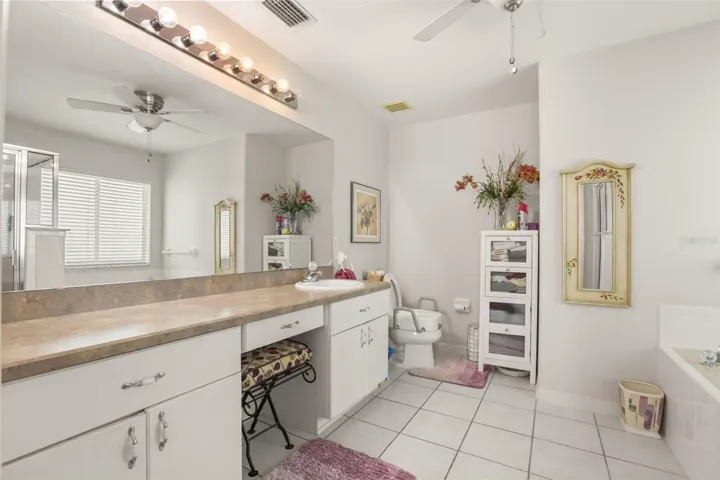 Large primary bathroom with dual vanities