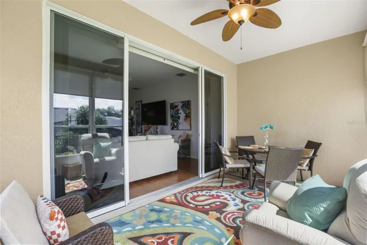 Enjoy peaceful mornings and evening sunsets from the enclosed Florida room overlooking the backyard.
