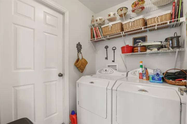 Convenient indoor laundry room with shelves