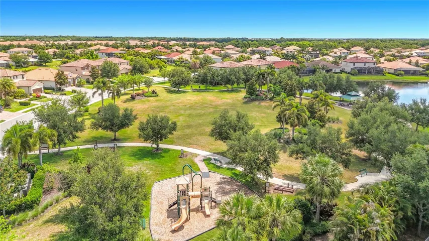 Walking path and open park space with playground.