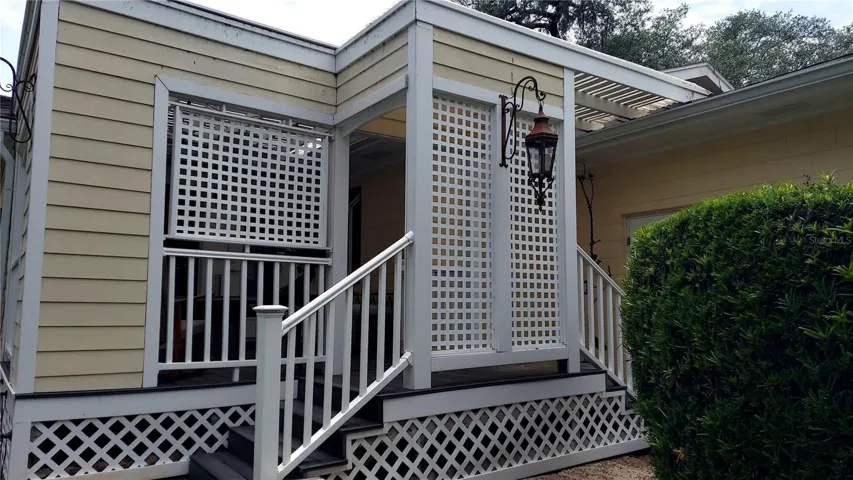 Steps from Breakfast Porch to Backyard and Garage