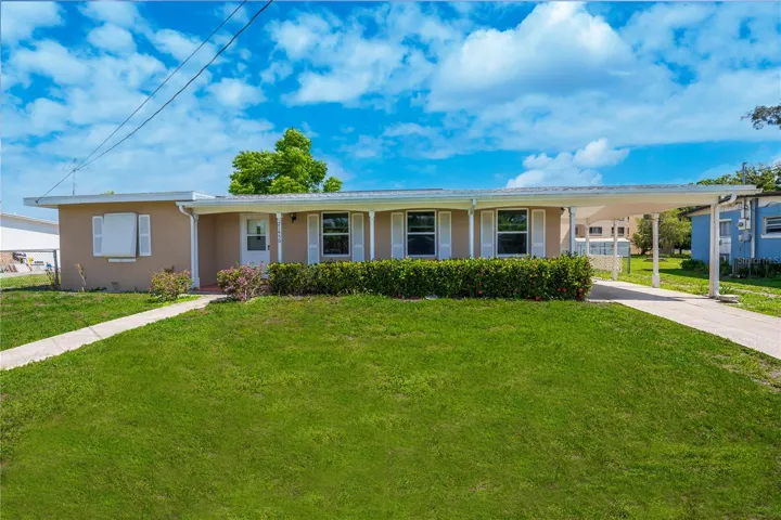 Charming Curb Appeal with Covered Front Porch and Long Driveway.