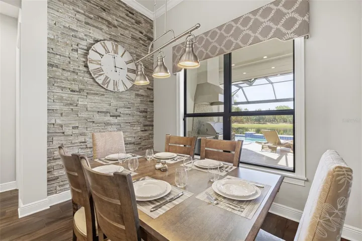 Dining area with beautiful stone accent wall