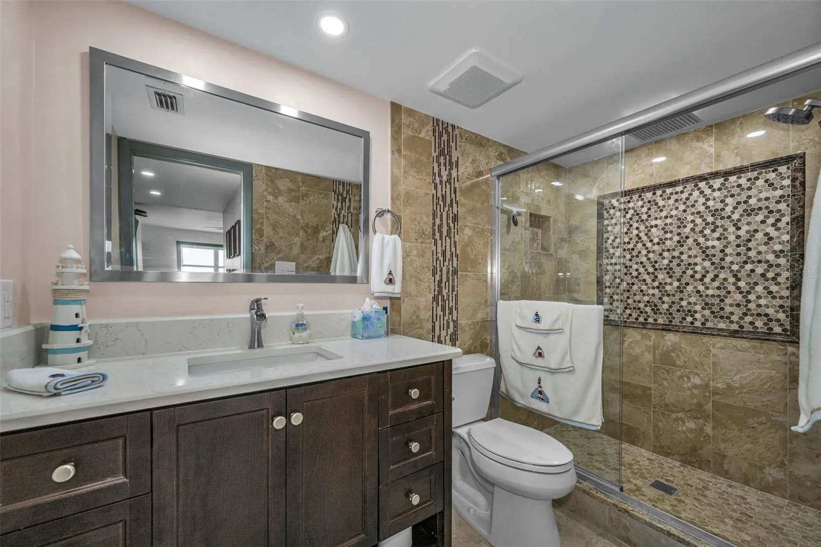 Primary Bathroom with new shower, toilet and vanity, plus overhead lighting.  Gorgeous.