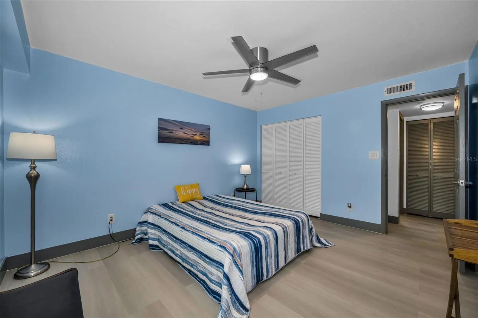 Second bedroom with double closet and new fan.