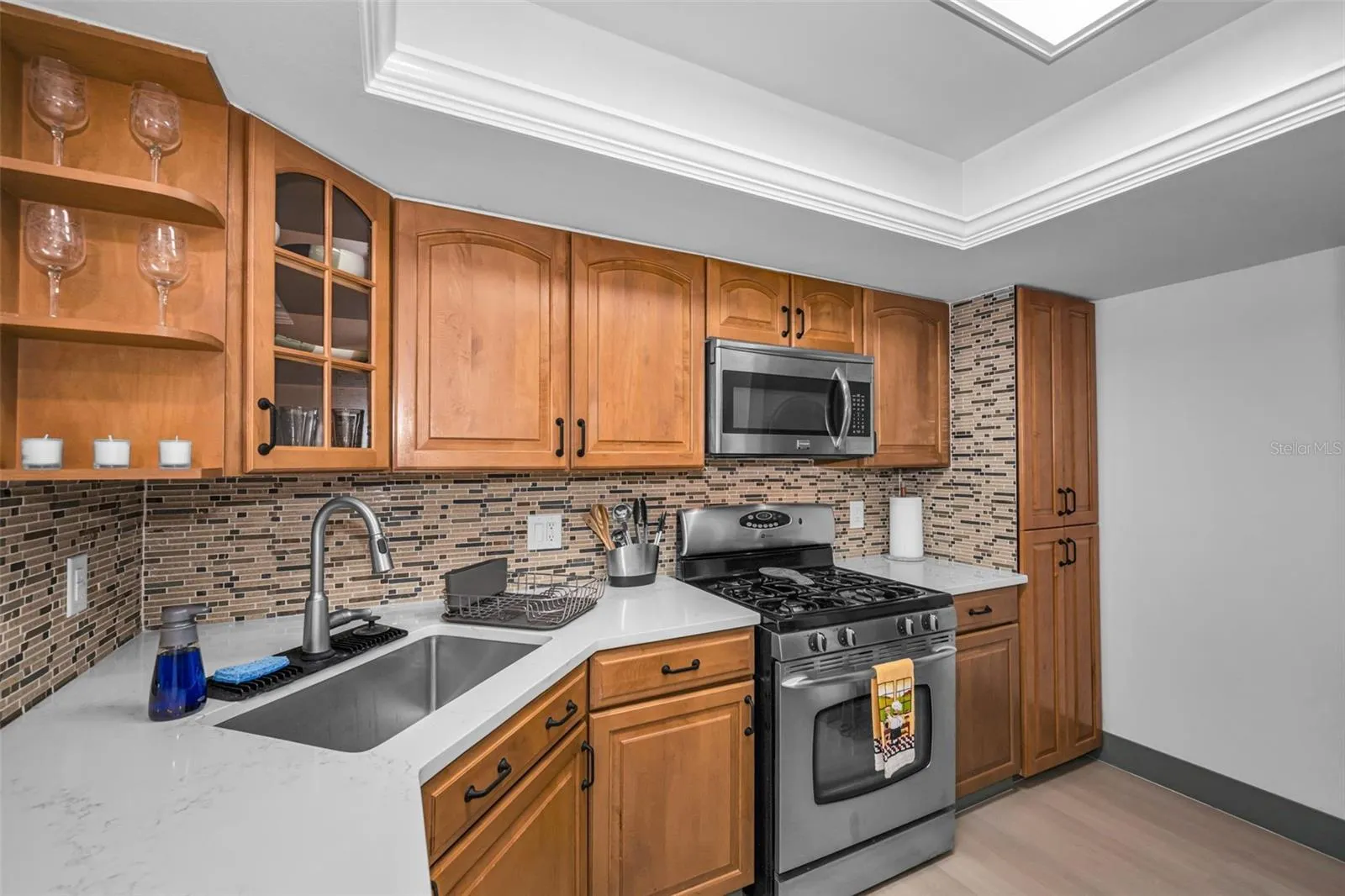 Kitchen with gas range, microwave, new backsplash, new Quartzite counter, sink &amp; faucet!