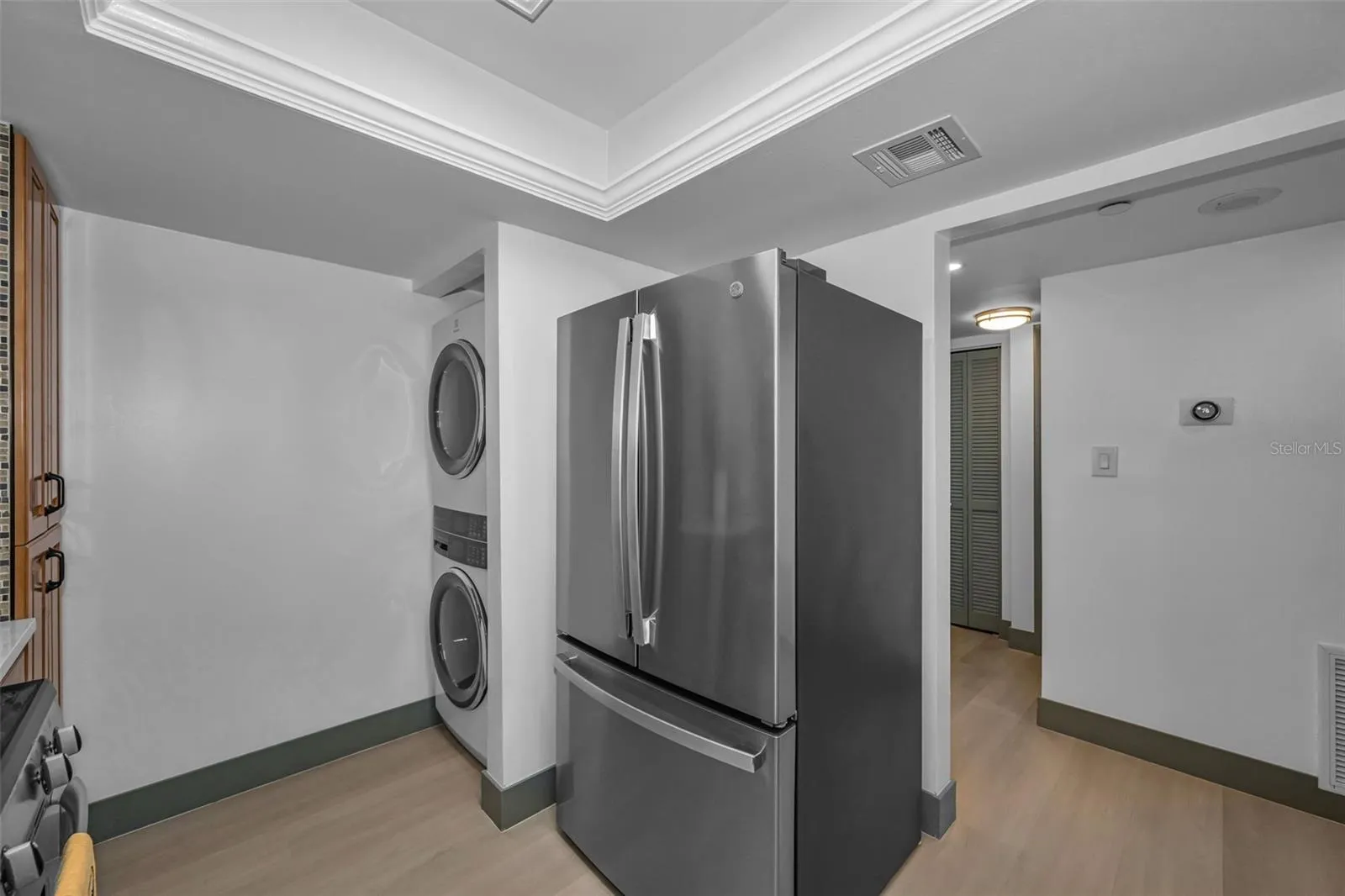 Brand new washer and dry, and refrigerator in kitchen.